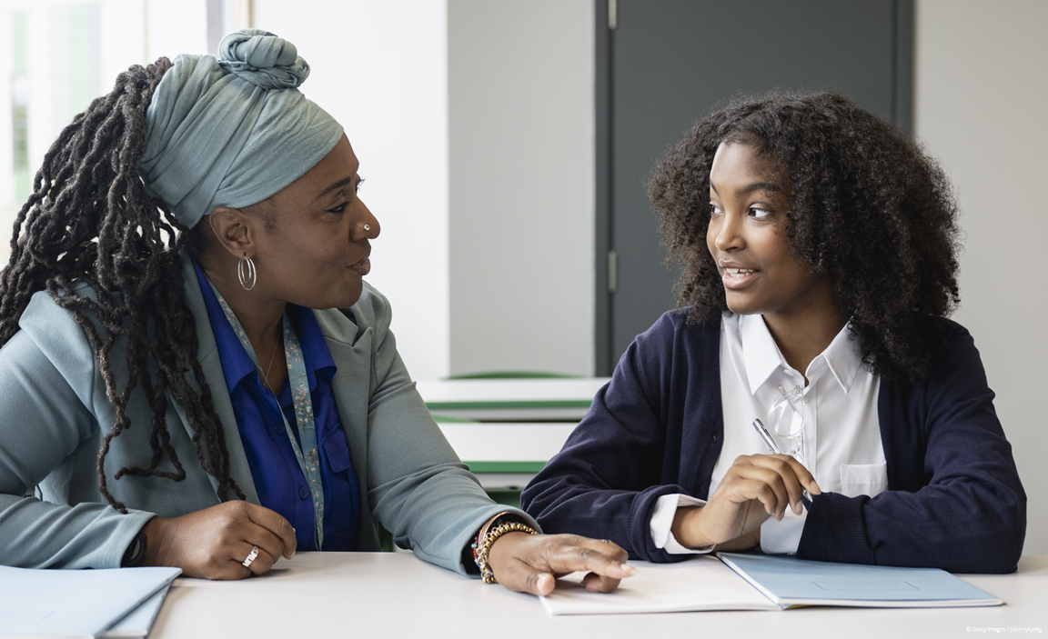A student and teacher talking